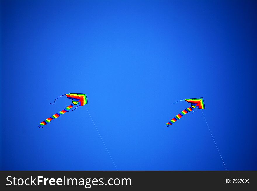 Two kites flew high in the sky. Two kites flew high in the sky