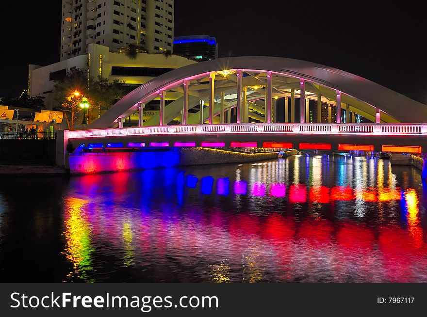 Bridge over river with colorful reflections. Bridge over river with colorful reflections