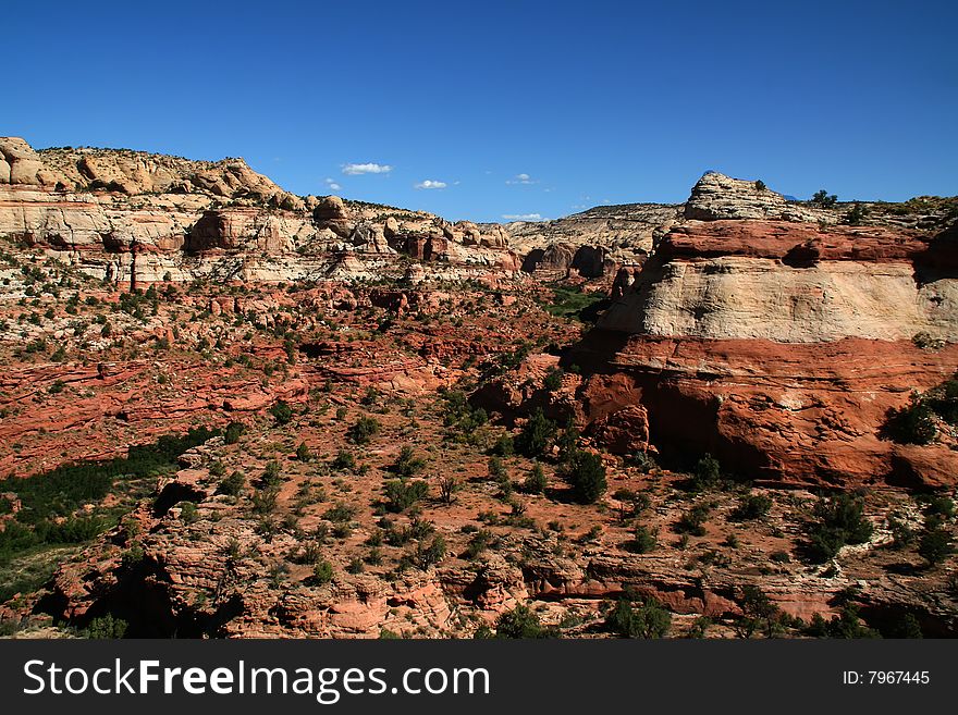 View of the red rock formations in Capitol Reef National Park with blue skyï¿½s and clouds