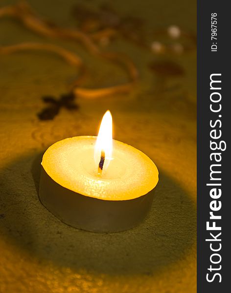 Candle and cross close-up