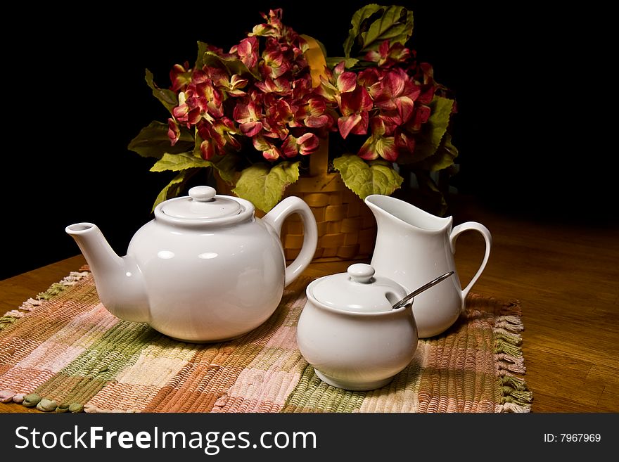 White porcelain Tea Set with floral arrangement. White porcelain Tea Set with floral arrangement
