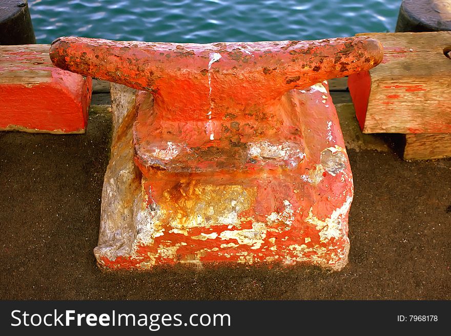 Old anchor on a deck at Half Moon Bay