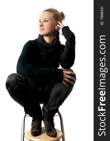 Girl that is sitting on a bar stool. Girl that is sitting on a bar stool.
