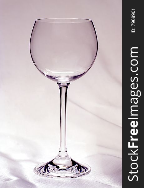 Empty glass of wine on a white cloth