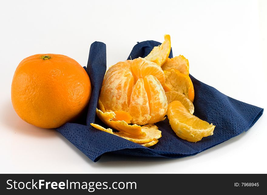 Two mandarines and dark blue serviette