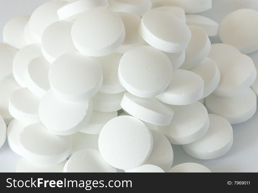 White round pill on the white isolated background