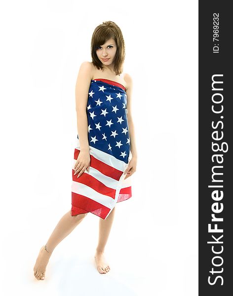 Beautiful young nude woman wrapped into the American flag. Beautiful young nude woman wrapped into the American flag