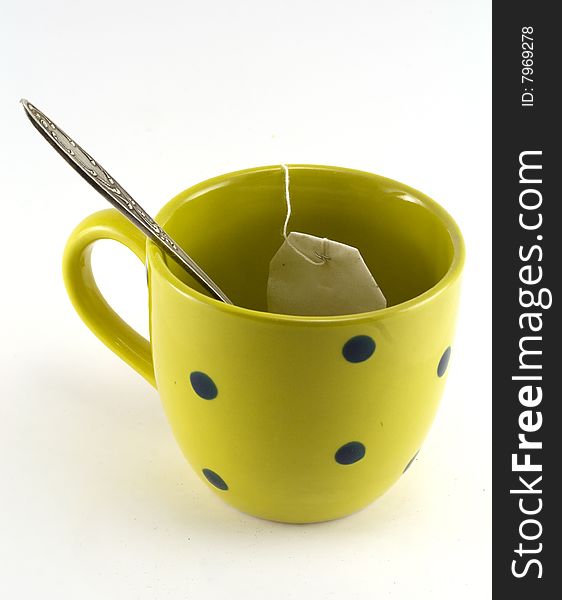 Cup with a spoon on white background