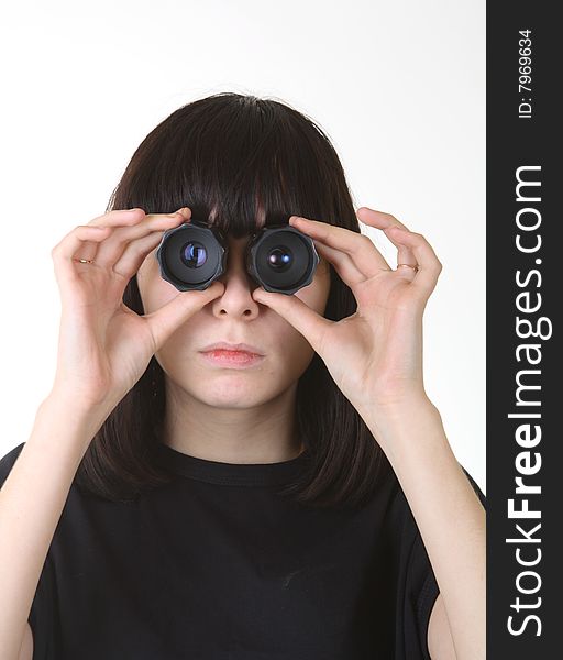 Young girl looking to camera through photo lenses. Young girl looking to camera through photo lenses