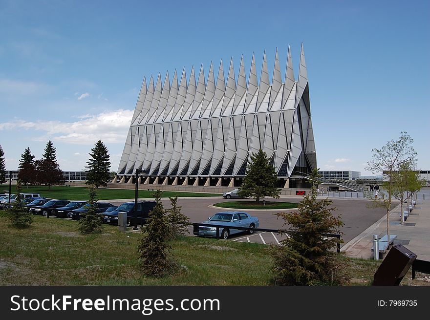 A view of the front entrance and the side of the striking, landmark building that is the U.S. Air Force Academy Chapel, Colorado Springs, Colorado. A view of the front entrance and the side of the striking, landmark building that is the U.S. Air Force Academy Chapel, Colorado Springs, Colorado.