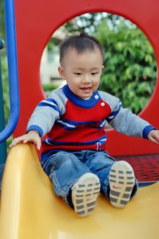 Asian Boy Playing The Sliding Board Stock Photo Asian Boy Playing The Sliding Board Stock Photo