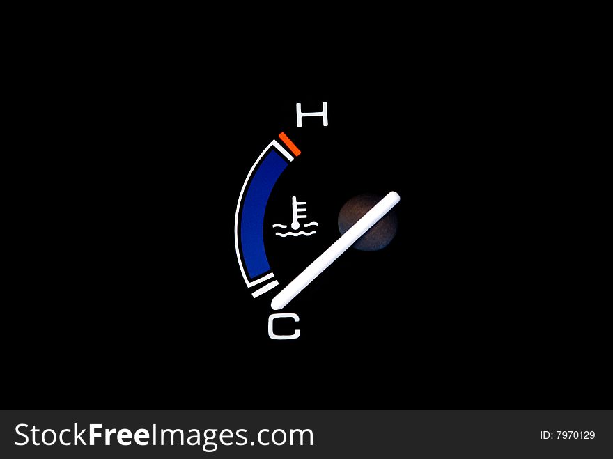 Temperature gauge of a vehicle. Isolated on a black background with planty of copyspace. Temperature gauge of a vehicle. Isolated on a black background with planty of copyspace.