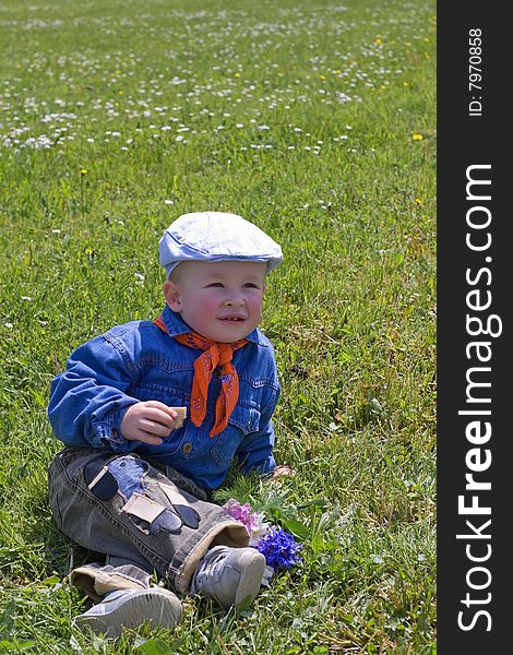 Little Boy On The Grass