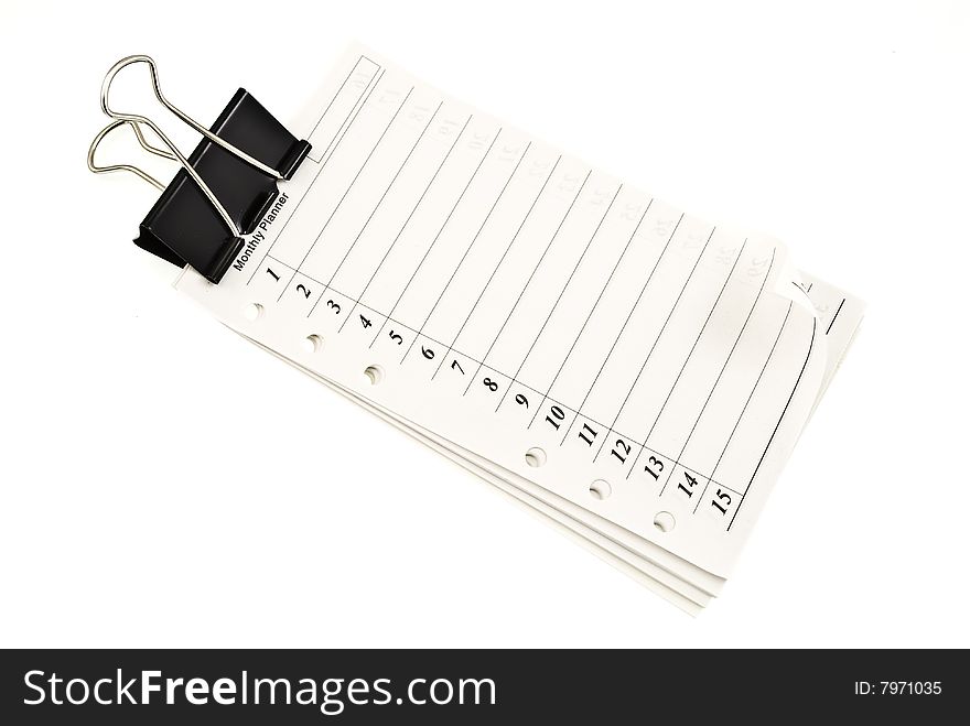Notepad with document clip on white
