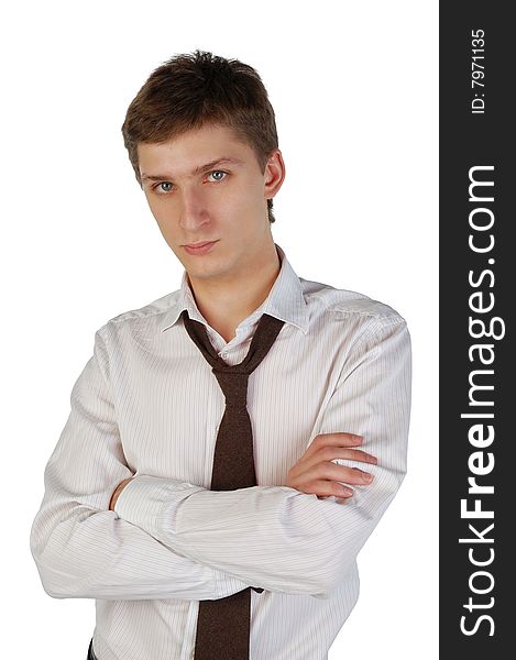 Serious young man with crossed arms. Isolated.