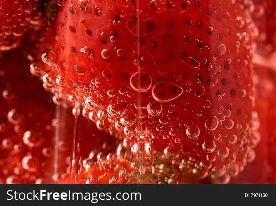 Close up picture of strawberries in glass with water