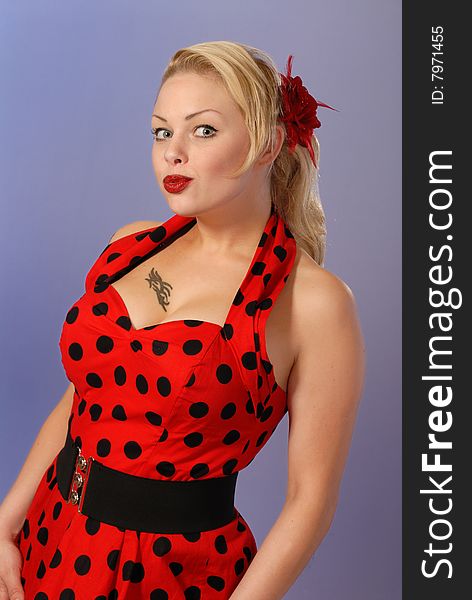 Gorgeous fifties burlesque blond in red polka-dot dress. Gorgeous fifties burlesque blond in red polka-dot dress