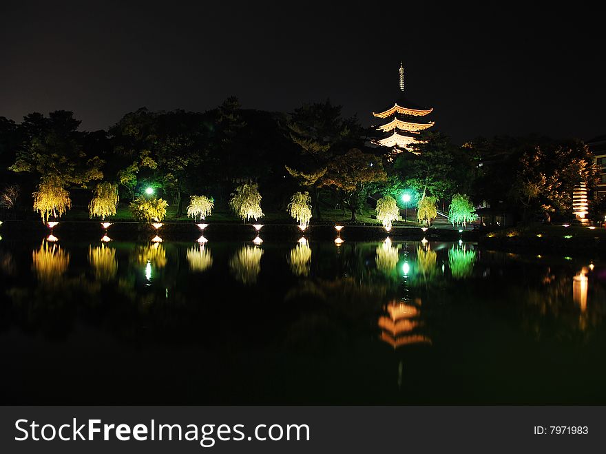 Lightup of five-storet pagoda viewed from Sarusawaike pond, Nara, Japan. Lightup of five-storet pagoda viewed from Sarusawaike pond, Nara, Japan