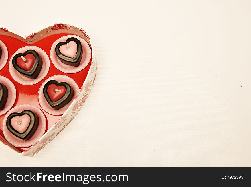 Detail shot of small pink and red heart shaped candles. Detail shot of small pink and red heart shaped candles.