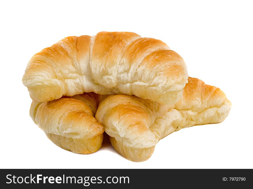 Three fresh Croissants isolated over white background. Three fresh Croissants isolated over white background