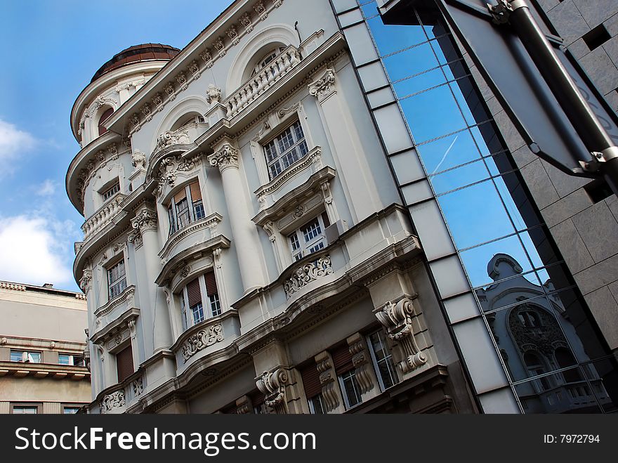 Building in center of Belgrade, Serbia, plane in window reflection. Building in center of Belgrade, Serbia, plane in window reflection