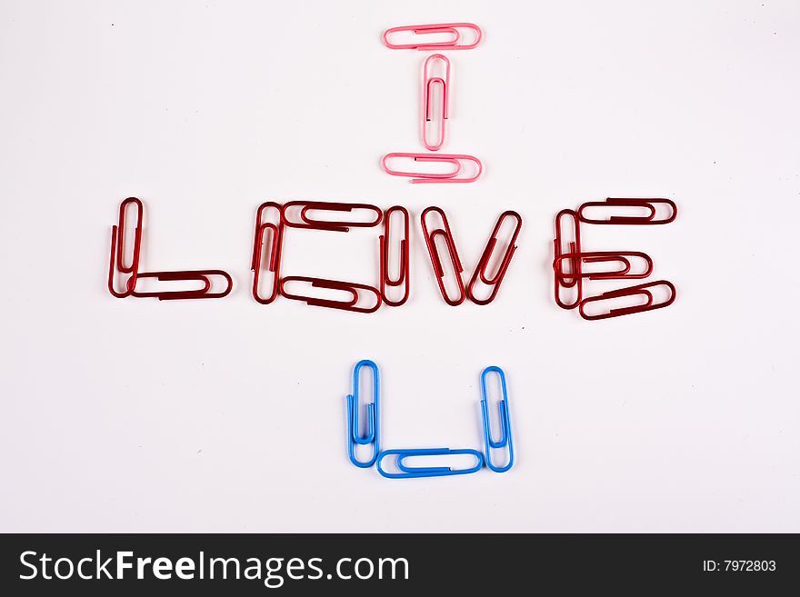 Paper clips arranged to say I Love U. Paper clips arranged to say I Love U