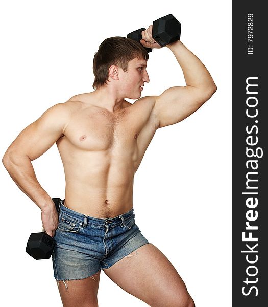 Strong man does(makes) exercise with black dumbbel