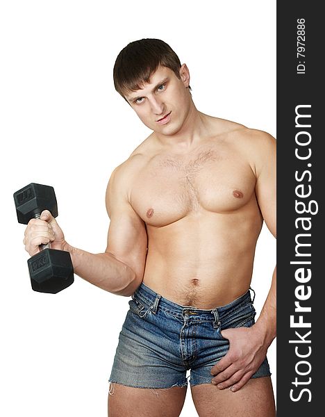 The man does(makes) gymnastic exercises with dumbbell. The man does(makes) gymnastic exercises with dumbbell