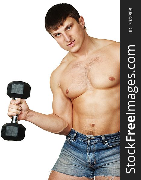 The man does(makes) gymnastic exercises with dumbbell. The man does(makes) gymnastic exercises with dumbbell