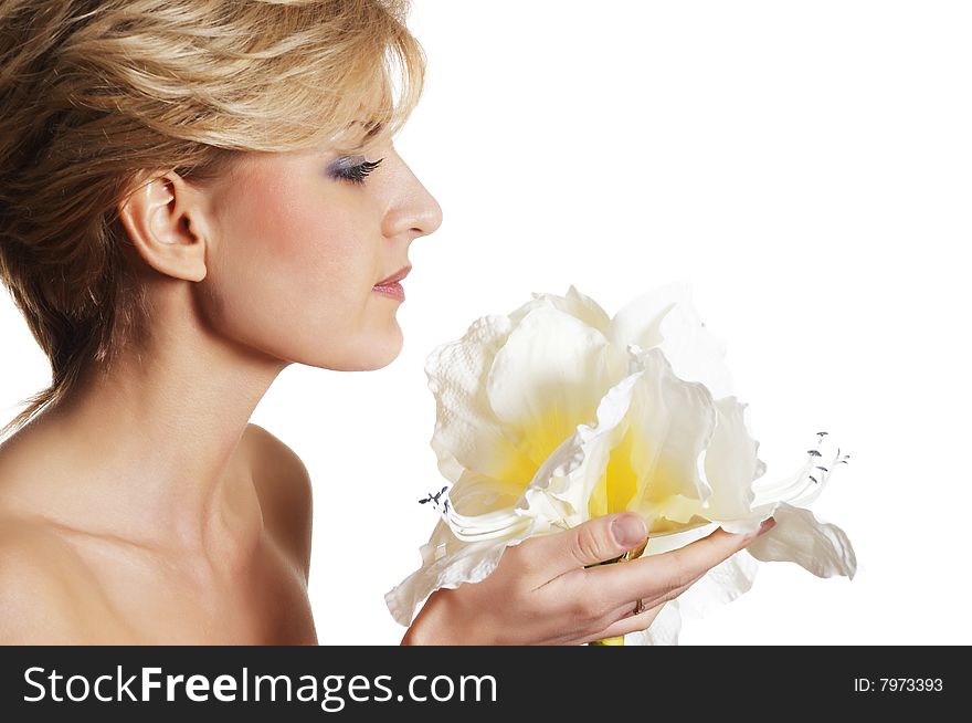 The attractive young girl with beautiful large flower. The attractive young girl with beautiful large flower