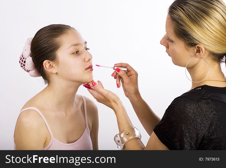 Young model takes make up from artist