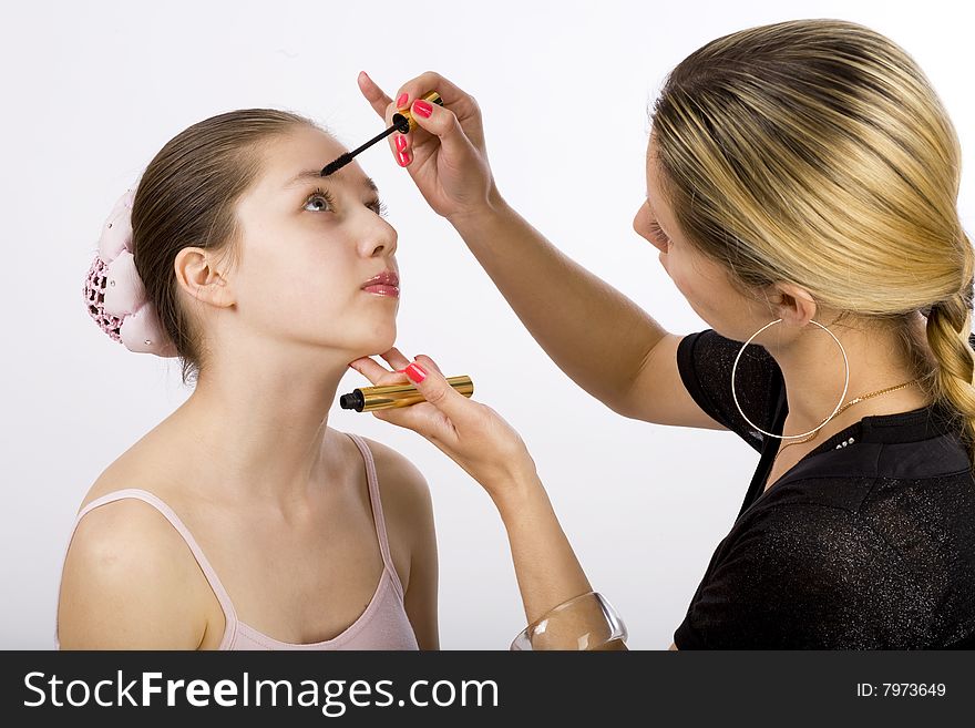 Young model takes make up from artist