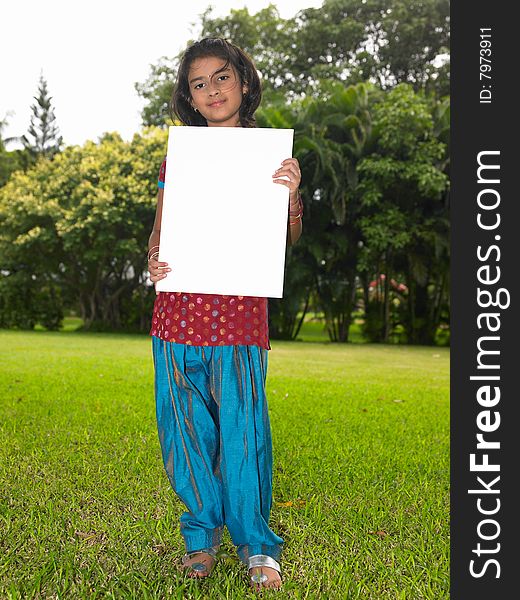 Girl child with blank placard