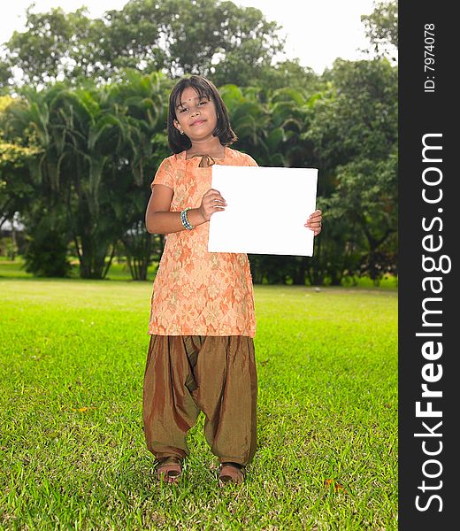 Girl child with blank placard