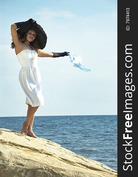 Girl  Holds Headscarf On A Wind