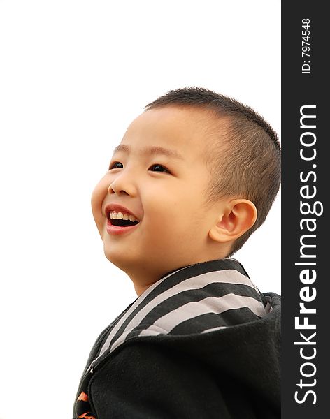 Cute young boy playing cheerfully. Cute young boy playing cheerfully