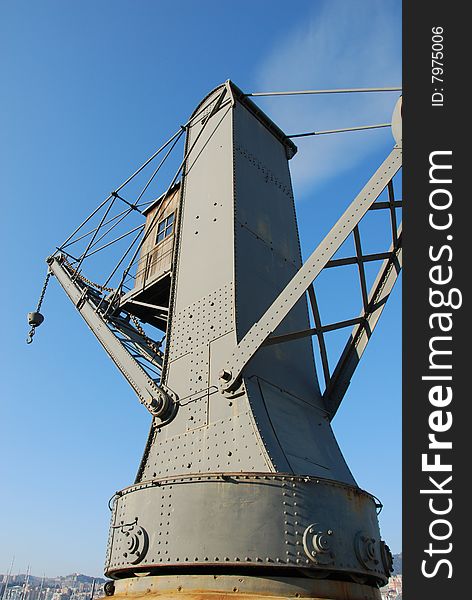 A restorated old crane located in genoa harbour