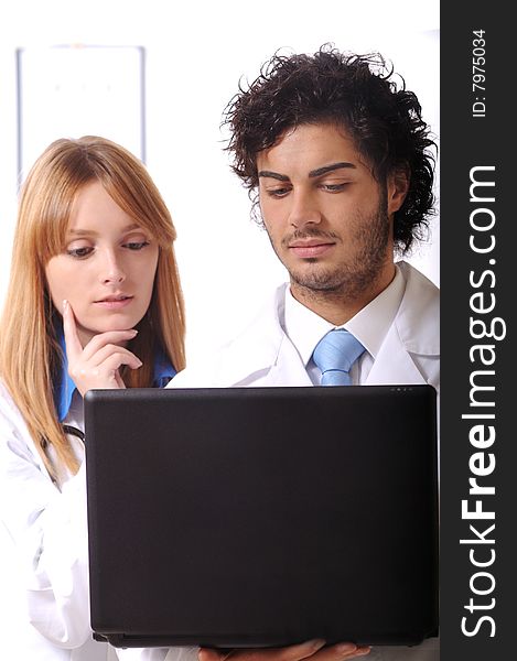 Young doctors use laptop on the white background