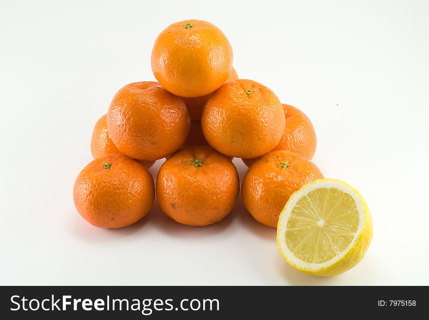 Pyramid from mandarines on white background