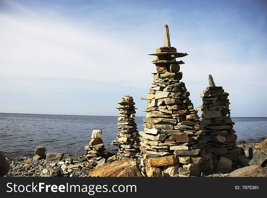 Stack of stones in front of water. Stack of stones in front of water.