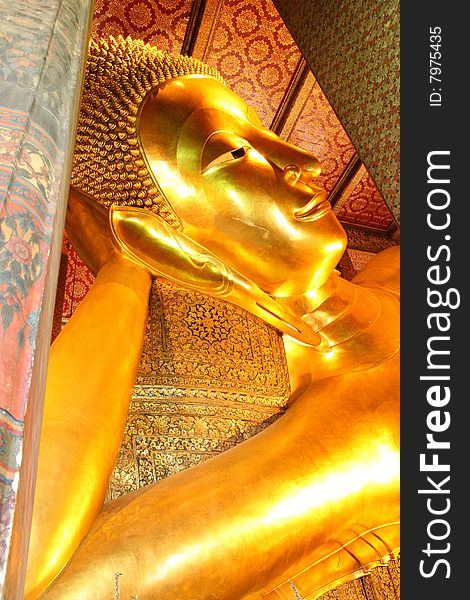 One of the most famous Buddha image in Thailand. The reclining Buddha of Wat Pho, Bangkok, Thailand. One of the most famous Buddha image in Thailand. The reclining Buddha of Wat Pho, Bangkok, Thailand.