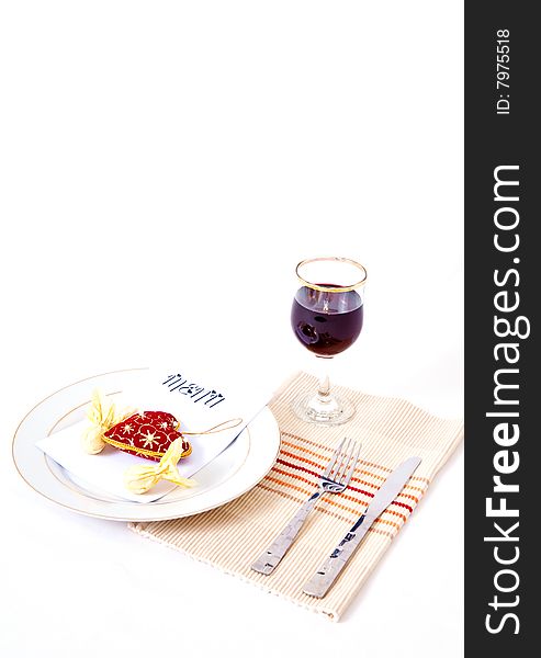 A romantic meal place setting against an isolated background. A romantic meal place setting against an isolated background.