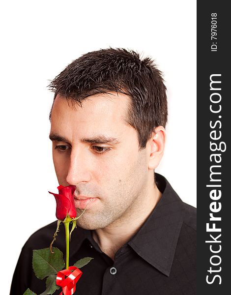 Man smelling a beautiful red rose. Man smelling a beautiful red rose