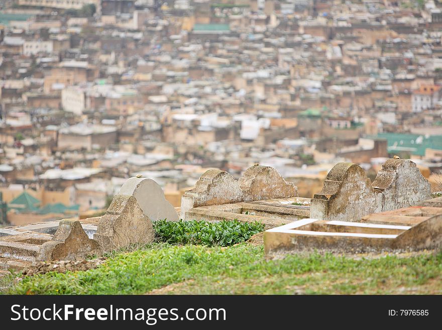 Muslim cemetery with Fes medina view background, Morocco