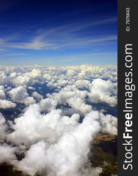 Aerial view of cloudscape over a cityscape.