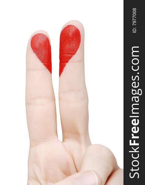 Red heart drawn on fingers on a white background (isolated)