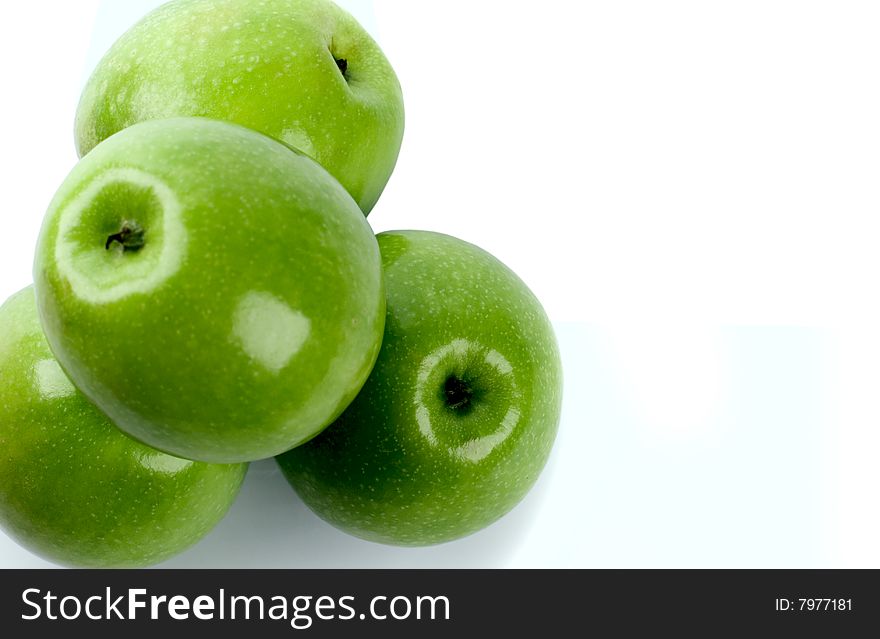 Closeup of green apples on white background