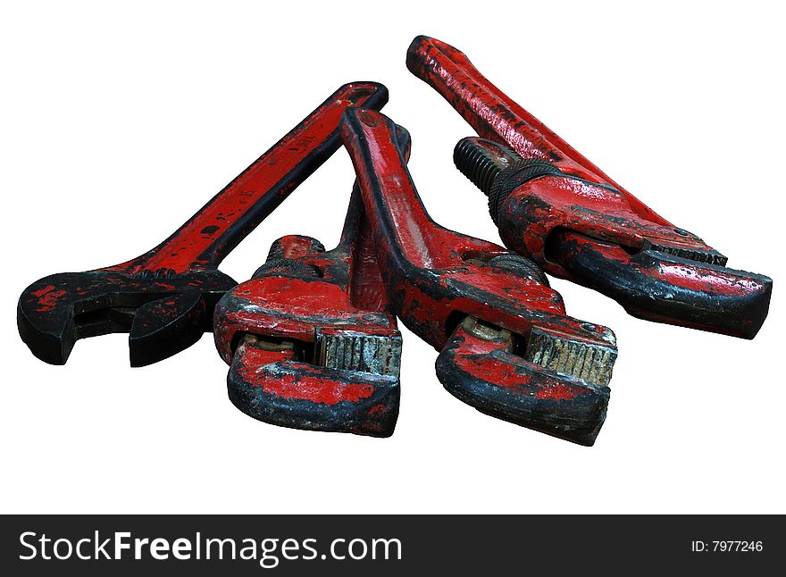 Old red spanners on the white background