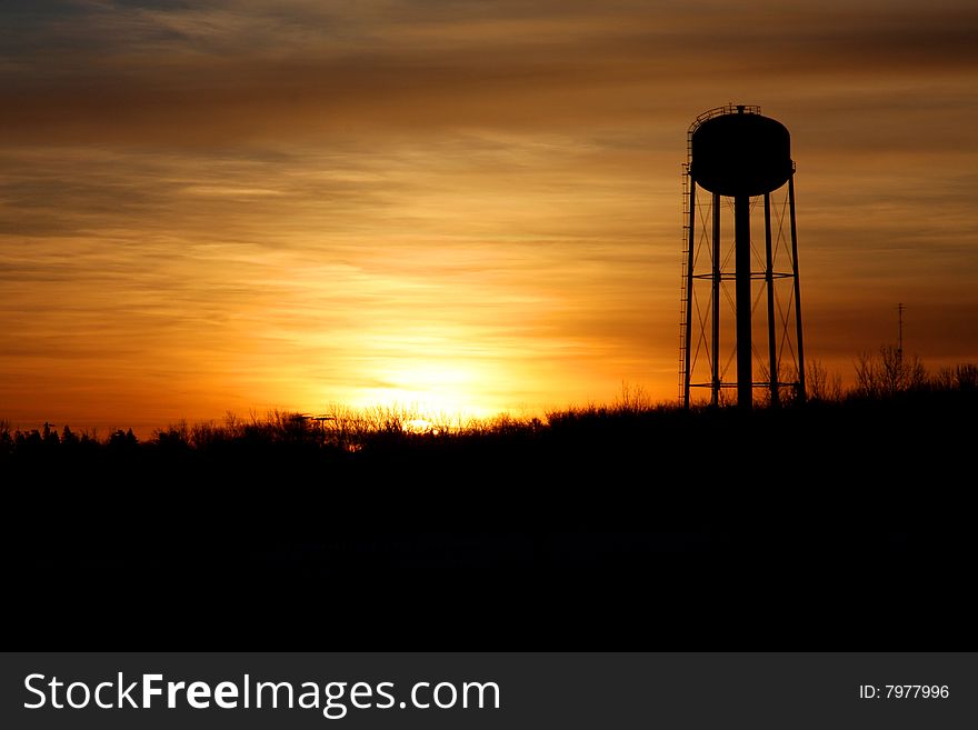 Silhouette of watertower at sunrise