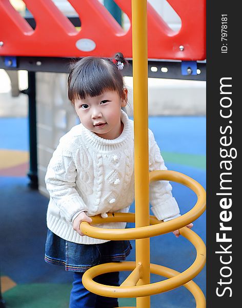 Bright picture of adorable chinese child in the playground. Bright picture of adorable chinese child in the playground